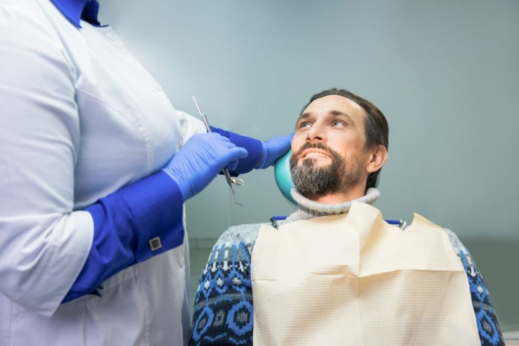A dentist advising a patient on root canal aftercare for smooth recovery.