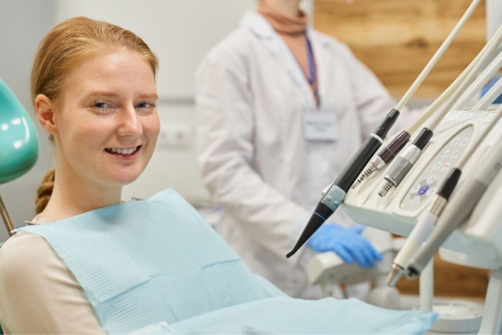 A happy patient smiling confidently after a cosmetic dentistry treatment.