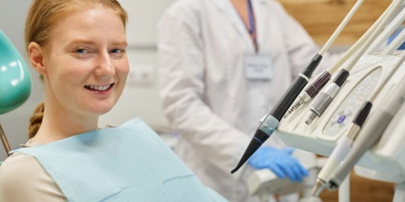 A happy patient smiling confidently after a cosmetic dentistry treatment.
