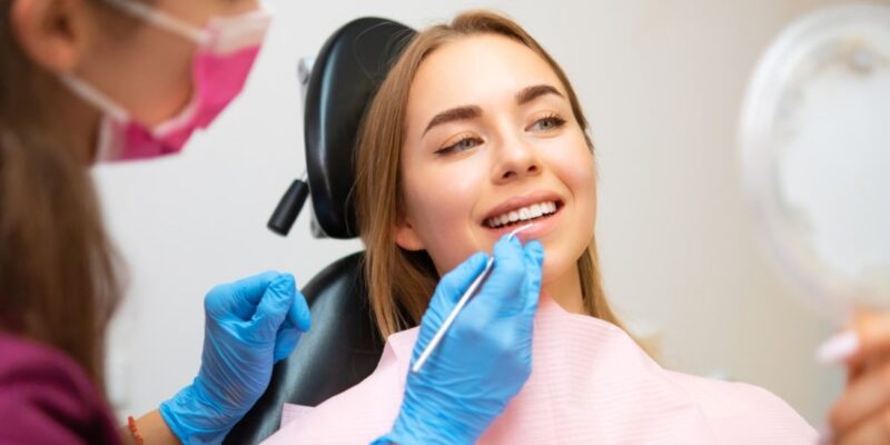 Patient smiling calmly during a dental checkup.